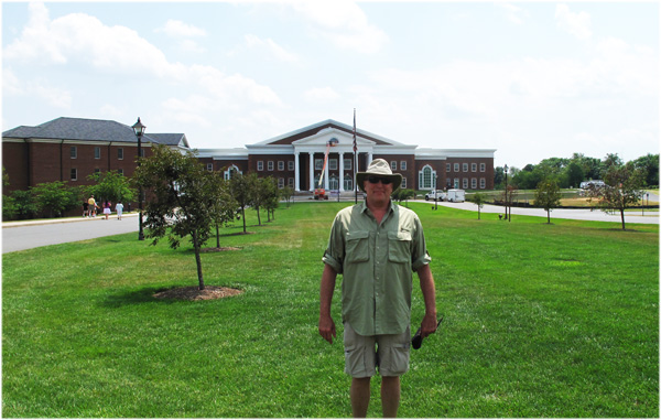 Michael L. Oddenino in front of the college